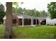 Exterior view of the covered carport attached to the brick home with a black vehicle at 925 Grace Ave, Lancaster, SC 29720