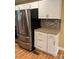 Modern kitchen featuring stainless steel refrigerator and granite countertops at 925 Grace Ave, Lancaster, SC 29720