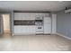 The kitchen area has tile flooring, ample cabinet space, and modern appliances at 925 Grace Ave, Lancaster, SC 29720