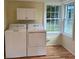 Functional laundry room with a washer, dryer, and natural light at 925 Grace Ave, Lancaster, SC 29720