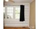 Living area featuring built-in shelves with hardwood floors and natural light at 925 Grace Ave, Lancaster, SC 29720