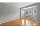 Serene bedroom with hardwood floors, neutral walls, and multiple windows providing ample natural light at 9321 Bradstreet Commons Way, Charlotte, NC 28215