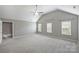 Large bedroom with neutral colors, vaulted ceiling, lots of windows, and ample natural light at 9321 Bradstreet Commons Way, Charlotte, NC 28215