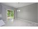 Bright dining room with sliding glass doors that lead to a patio and backyard at 9321 Bradstreet Commons Way, Charlotte, NC 28215