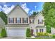 Charming two-story home with a two-car garage, brown shutters, and beautifully landscaped front yard at 9321 Bradstreet Commons Way, Charlotte, NC 28215