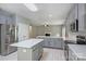 Charming kitchen with an island, stainless steel appliances, white countertops and grey cabinets at 9321 Bradstreet Commons Way, Charlotte, NC 28215