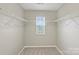 Walk-in closet with wire shelving and a window, providing ample storage space at 9321 Bradstreet Commons Way, Charlotte, NC 28215