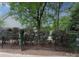 Fenced backyard featuring mature landscaping, a pool and perimeter trees at 9624 Barnburgh Ln, Huntersville, NC 28078