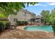 Backyard with an in-ground pool, brick patio, and screened porch for outdoor enjoyment at 9624 Barnburgh Ln, Huntersville, NC 28078