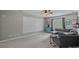 Large bonus room is perfect for relaxation and entertainment, featuring a ceiling fan and plush carpeting at 9624 Barnburgh Ln, Huntersville, NC 28078