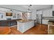 Open concept kitchen with an island featuring lots of cabinets and counter space at 9624 Barnburgh Ln, Huntersville, NC 28078
