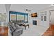Living room boasts built-in shelves, a fireplace, plush gray seating, and large windows for natural light at 9624 Barnburgh Ln, Huntersville, NC 28078