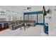 Spacious living room connected to the kitchen features a fireplace, comfortable seating, and ample natural light at 9624 Barnburgh Ln, Huntersville, NC 28078