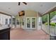 Inviting screened-in porch with wood flooring, a ceiling fan, and plenty of natural light and outdoor access at 9624 Barnburgh Ln, Huntersville, NC 28078