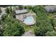 Aerial view of the pool and tennis courts nestled among mature trees and landscaping at 108 Pier 33 Dr # 414, Mooresville, NC 28117