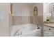Inviting bathroom with a soaking tub and decorative wall accents creating a serene and relaxing space at 108 Pier 33 Dr # 414, Mooresville, NC 28117