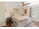 Charming bedroom featuring a queen-size bed, hardwood floors, and stylish decor, creating a cozy retreat at 108 Pier 33 Dr # 414, Mooresville, NC 28117