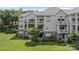 Beautiful condo building with landscaped grounds, charming balconies, and a serene setting at 108 Pier 33 Dr # 414, Mooresville, NC 28117