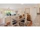 Charming dining area with seating for four and views of the outdoor balcony and living room at 108 Pier 33 Dr # 414, Mooresville, NC 28117