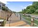 Picturesque view of a wooden boardwalk that leads to a boat dock on the water at 108 Pier 33 Dr # 414, Mooresville, NC 28117