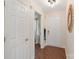 Hallway with wood floors leading to the front door at 108 Pier 33 Dr # 414, Mooresville, NC 28117