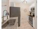 Modern kitchen with stainless steel appliances, granite countertops, and tile flooring at 108 Pier 33 Dr # 414, Mooresville, NC 28117