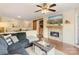 Comfortable living room featuring a fireplace, TV, and access to the dining and kitchen areas at 108 Pier 33 Dr # 414, Mooresville, NC 28117