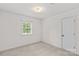 Bedroom with a window providing natural light and neutral carpet at 115 Three Oaks Ln, Statesville, NC 28677