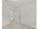 Bright bedroom features neutral carpet, white walls, and ample natural light at 115 Three Oaks Ln, Statesville, NC 28677