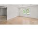 View of dining room area with light fixture and large window to the exterior at 115 Three Oaks Ln, Statesville, NC 28677