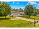 Charming home with a well-manicured lawn and attached two-car garage at 115 Three Oaks Ln, Statesville, NC 28677