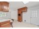 View of the kitchen featuring wooden cabinets and a white door to the outside at 115 Three Oaks Ln, Statesville, NC 28677