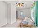 Bright living room with comfortable couch, ceiling fan and a back door with view of outside at 115 Three Oaks Ln, Statesville, NC 28677
