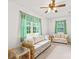 Cozy living room with comfortable couches, ceiling fan and a large window with view of outside at 115 Three Oaks Ln, Statesville, NC 28677