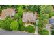 Stunning aerial view of a brick home nestled on a spacious lot surrounded by mature trees and landscaped grounds at 118 Sunrise Cir, Mooresville, NC 28117