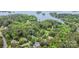 Stunning aerial view of wooded neighborhood near the water with private docks at 118 Sunrise Cir, Mooresville, NC 28117
