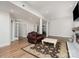 Spacious basement with fireplace, lounge chair, and adjacent work out room at 118 Sunrise Cir, Mooresville, NC 28117