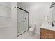 Bright bathroom features sleek vanity, frameless glass shower door and glass shelving at 118 Sunrise Cir, Mooresville, NC 28117