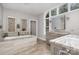 Luxurious bathroom featuring a soaking tub, double vanities, and natural stone accents at 118 Sunrise Cir, Mooresville, NC 28117