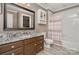 Bathroom featuring granite countertop, white wooden floor tiles, and a shower/tub with a colorful curtain at 118 Sunrise Cir, Mooresville, NC 28117