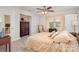 Comfortable bedroom featuring a ceiling fan, ample natural light, and neutral decor at 118 Sunrise Cir, Mooresville, NC 28117