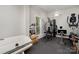 Home gym featuring rubber flooring, mounted wall mirror and modern exercise equipment at 118 Sunrise Cir, Mooresville, NC 28117