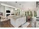 Open-concept kitchen island with granite countertops, pendant lighting, and seamless flow into the living room at 118 Sunrise Cir, Mooresville, NC 28117
