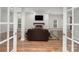 Open living room features a fireplace and large windows offering ample natural light at 118 Sunrise Cir, Mooresville, NC 28117