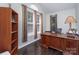 Home office with ample natural light, hardwood floors, and a built-in desk at 118 Sunrise Cir, Mooresville, NC 28117