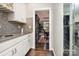 Butlers pantry with granite countertops and access to dining room, offering seamless entertaining at 118 Sunrise Cir, Mooresville, NC 28117