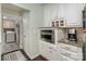 Pantry includes cabinets, built-in microwave, coffee maker and laundry room is just through the door at 118 Sunrise Cir, Mooresville, NC 28117