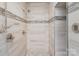 Walk-in shower with premium fixtures, tiled walls, and a glass door at 118 Sunrise Cir, Mooresville, NC 28117