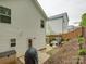 Backyard patio area with seating and barbeque, fenced yard and stone pathway at 1209 Gaston Ave, Gastonia, NC 28052