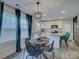 Bright and airy dining area with stylish decor and kitchen access at 1209 Gaston Ave, Gastonia, NC 28052